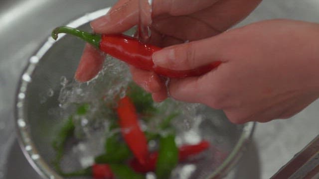 Washing Fresh Chili Peppers in a Colander