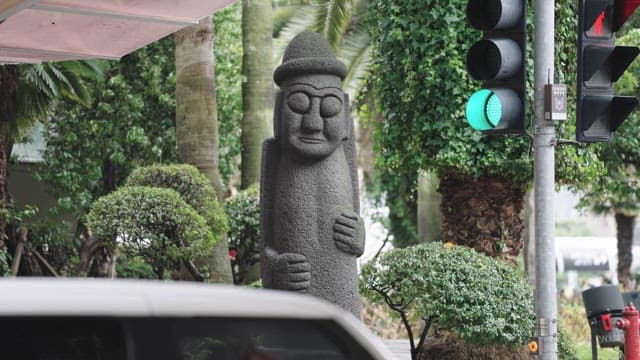 Dolhareubang Statue Next to the Traffic Light