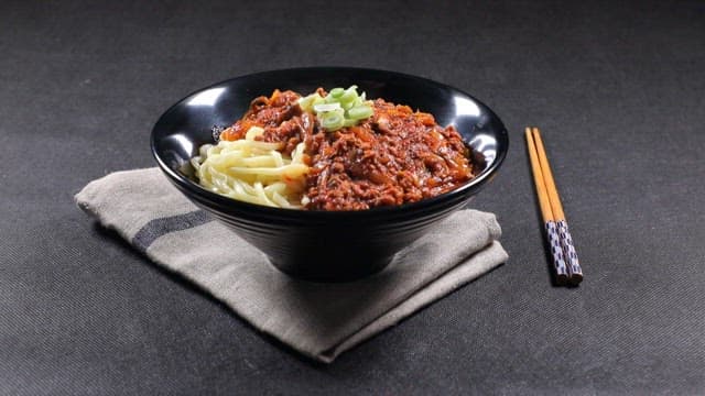 Appetizing Chinese meat noodles with green onion