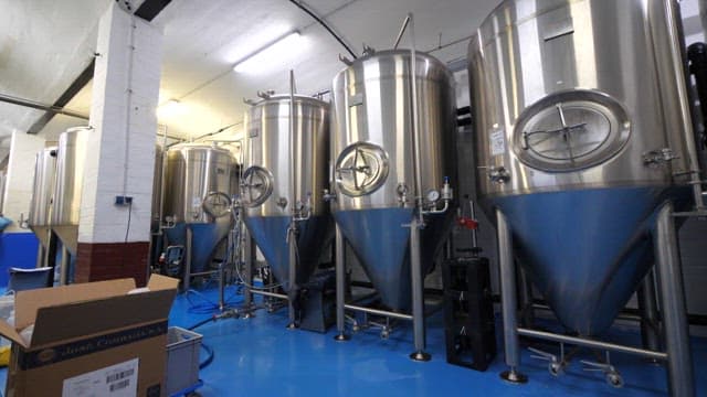 Industrial fermentation tanks in a factory