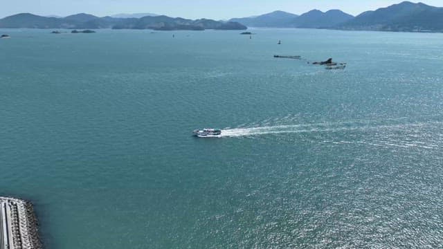 Boat cruising on a vast ocean