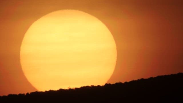 Majestic and Vivid Sunset Over the Hills