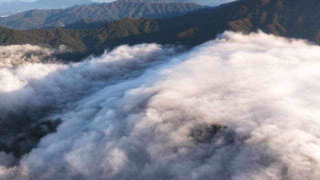 Clouds covering mountain peaks