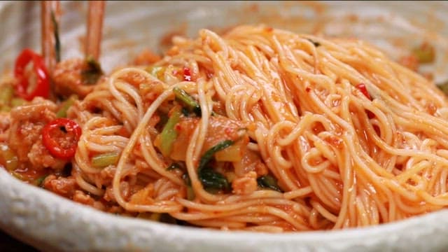Bowl of spicy young radish bibim noodles