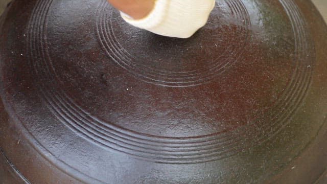 Milk curry boiling in a cauldron