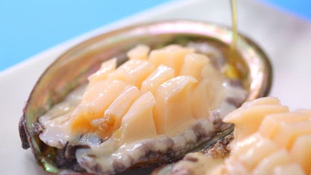Fresh abalone with sauce on a plate