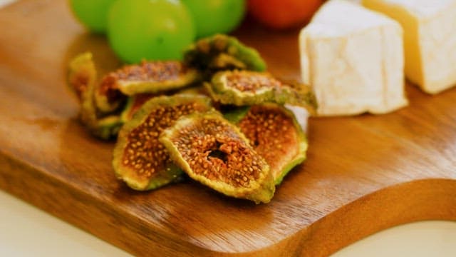 Sliced Figs on a Wooden Board