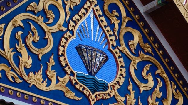 Detailed architectural design with colorful artwork of Buddhist temple