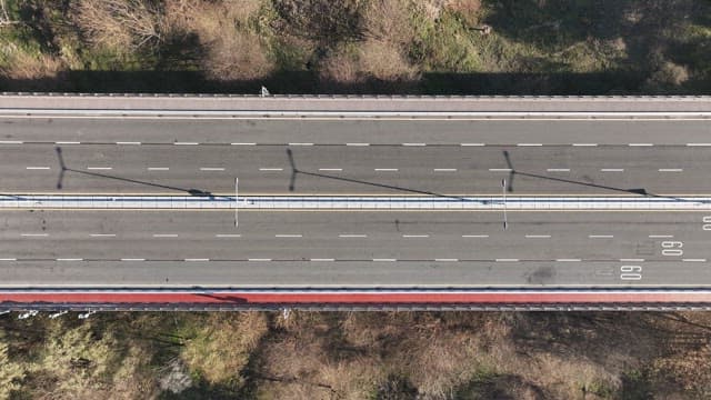 Vehicles Driving up a Road of Straight Bridge