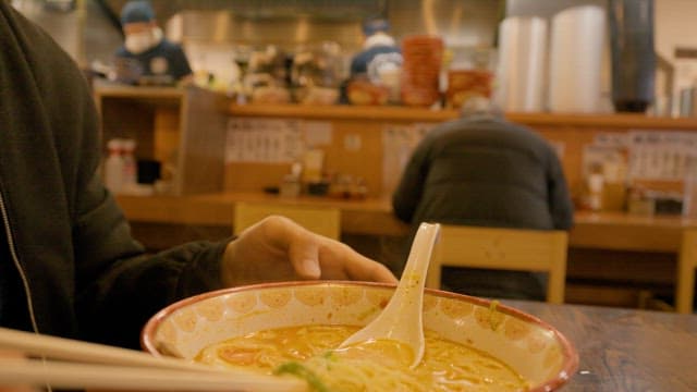 Enjoying a Bowl of Warm Ramen at a Local Eatery