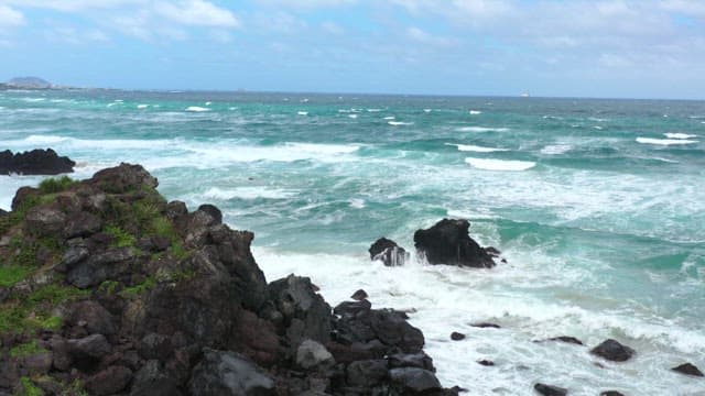 Waves crashing against rocky shore