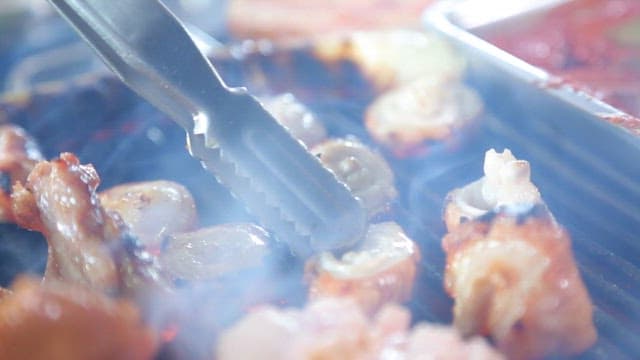 Oily and golden grilled tripe on the grill