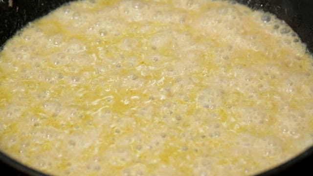 Pasta being cooked in a creamy sauce