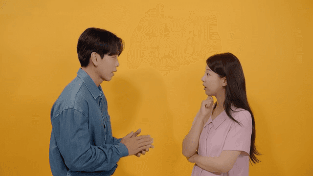 Man and a woman facing each other and talking intimately