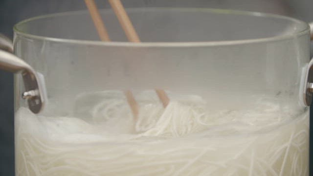 Noodles boiling in a pot