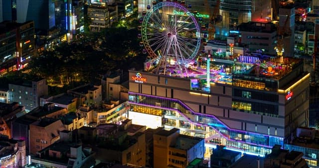 Night view of downtown Daegu illuminated by a ferris wheel at night