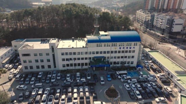 Downtown Police Dtation and Busy Parking Lot