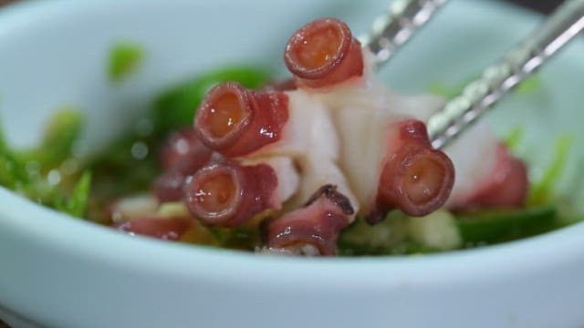 Parboiled octopus and chili peppers dipped in seasoning sauce