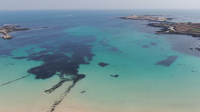 Clear blue sea with distant islands