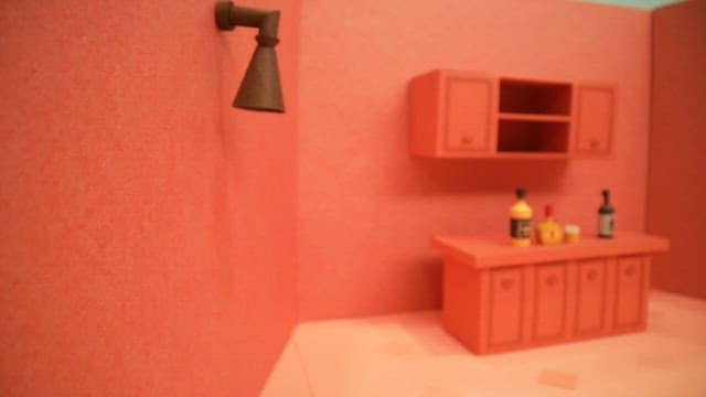 Diorama depicting a kitchen interior with red walls