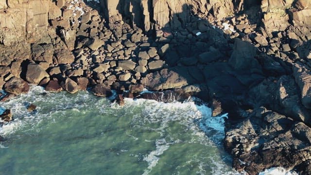 View of Rocky Seashore with Waves
