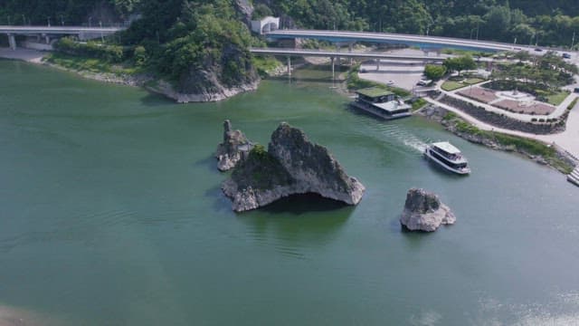 Serene River Landscape with Tourist Boat