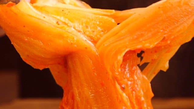 Braised spicy chicken wrapped in aged kimchi