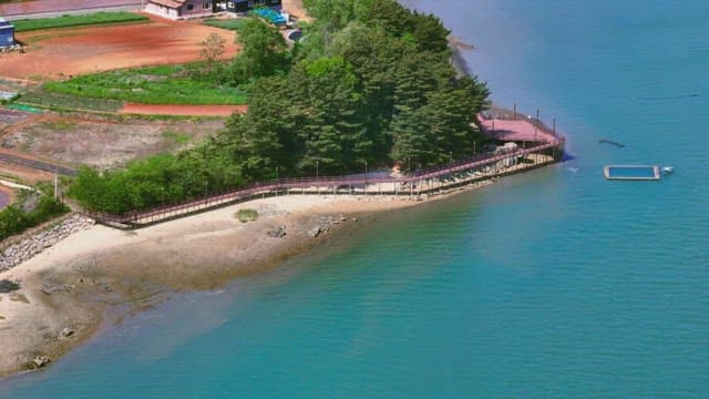 Coastal walkaway with fields and forests