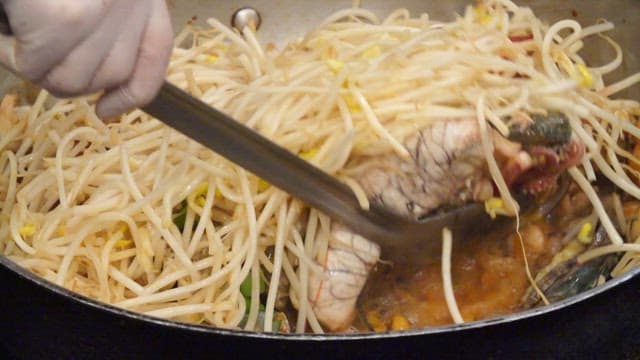 Braised spicy seafood with bean sprouts, abalone, squid, crab, and roe