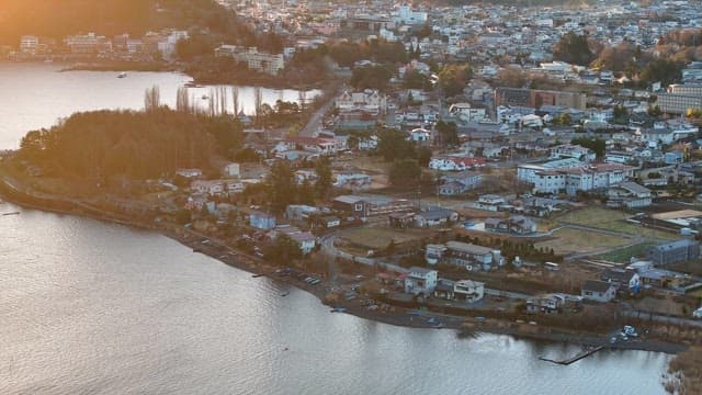 Serene city by the water at sunrise