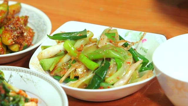 Korean green onion salad in a plate on a table