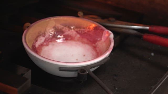 Melting gold in a crucible with flame