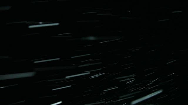 Snowfall on a military vehicle at night