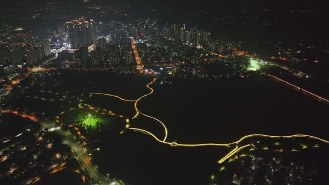 Night view of a city with illuminated paths