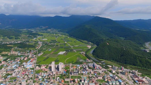 Rural village surrounded by green fields
