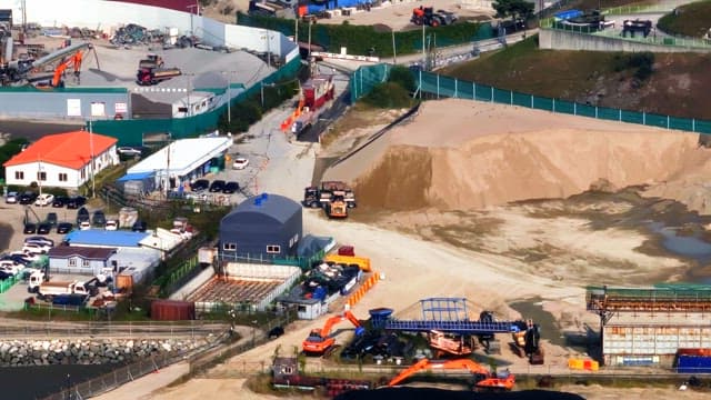 Construction site with machinery and buildings
