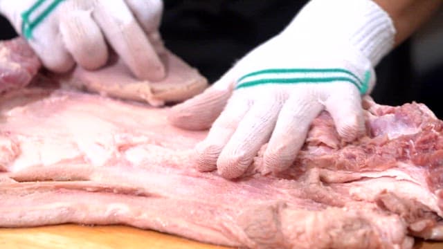 Preparing Meat on a Cutting Board
