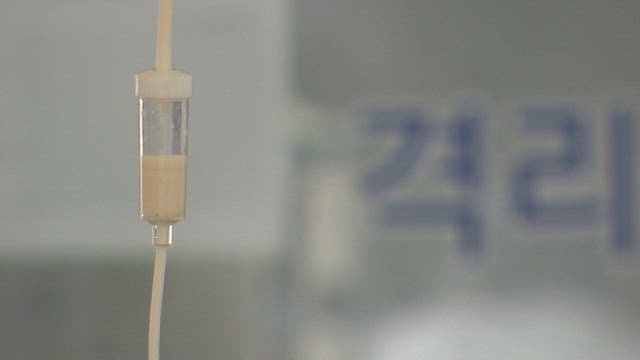 IV drip in a medical room with blurred background