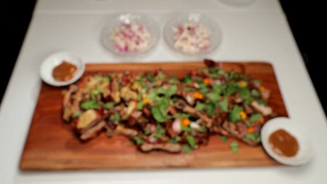 Pork ribs with green herbs and mustard sauce