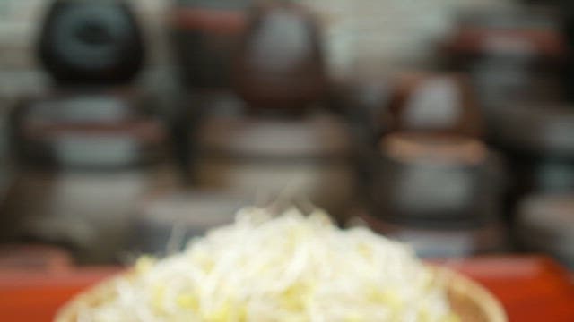 Fresh bean sprouts in a wooden basket on a table