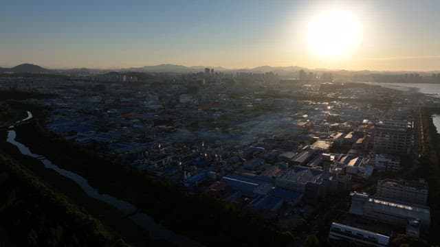 Sunset in an Industrial Complex with Dense Buildings and Factories