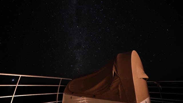 Starry night sky viewed from a deck