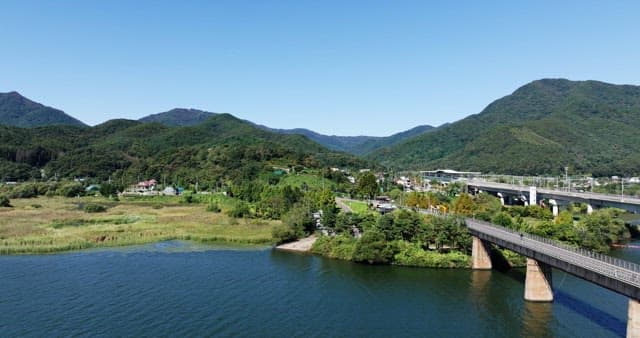 Scenic view of mountains and a bridge