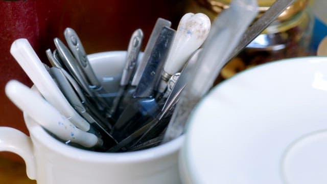 Cutlery with water in a cup