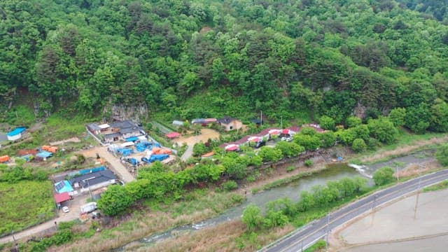 Rural village surrounded by lush forest