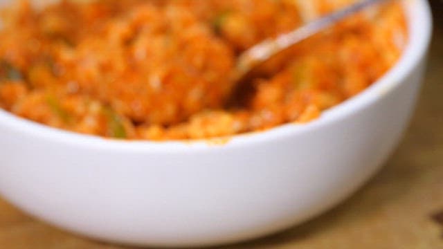 Spicy pork stew with rice topped with seaweed