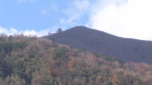 Observatory on a Forested Mountain Peak