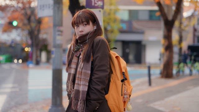Student waiting at a bus stop