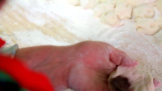 Person who puts red beans into the dough