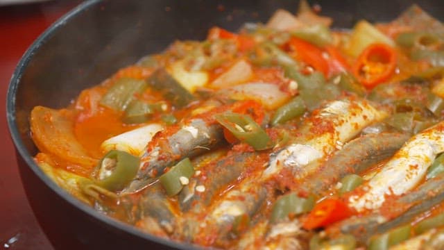 Delicious spicy fish stew with vegetables in pot